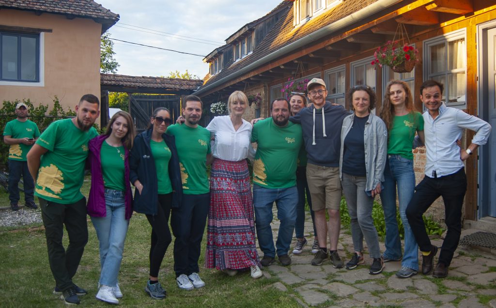 Group photo with the organisers of the first edition of Cobor Între Stejari festival standing in the courtyard of Cobor Biodiversity Farm